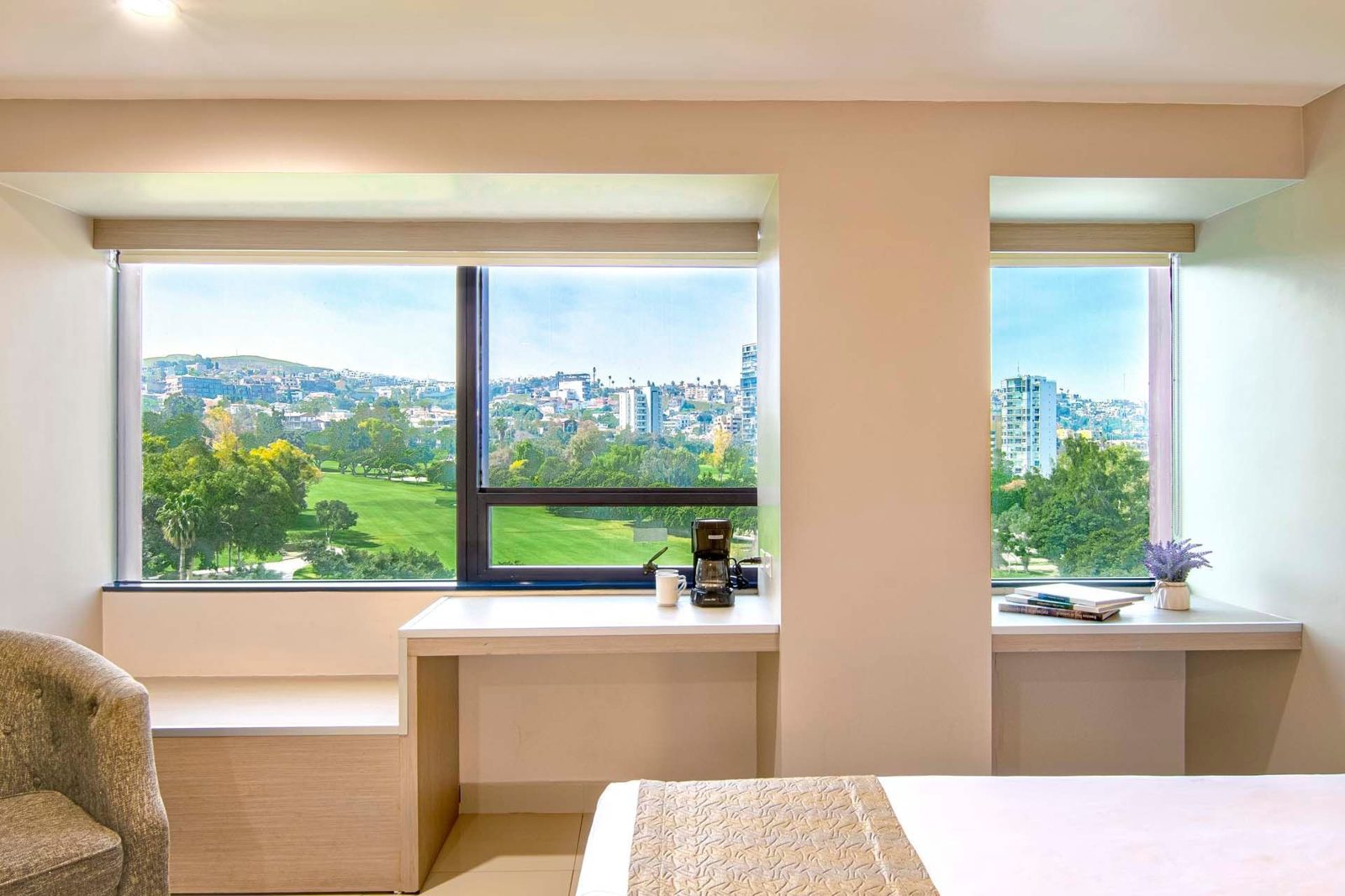 Grand Care room with city and golf course views